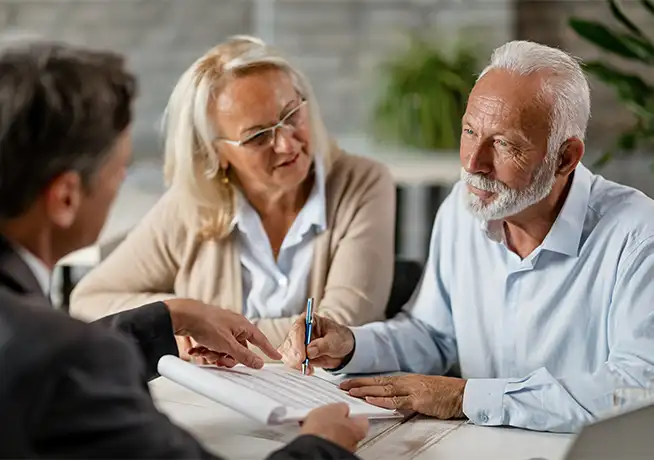 financial advisor meeting with retirees to discuss keys to a successful retirement